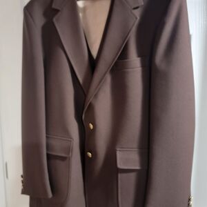 Classic brown suit. Has jacket, vest and matching pants. Size 44R